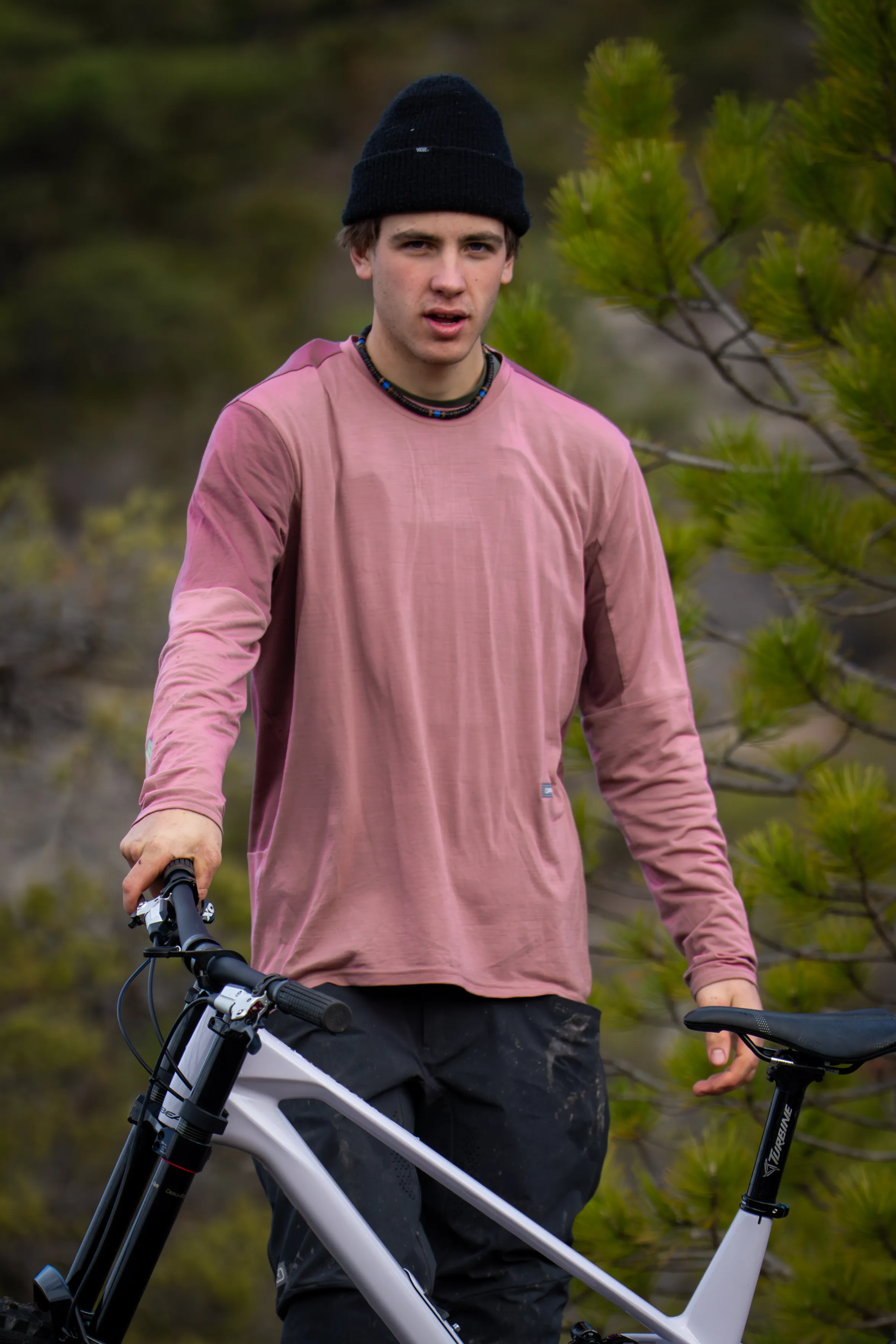 pink shirt, long sleeves, beanie, bicycle, mountain bike