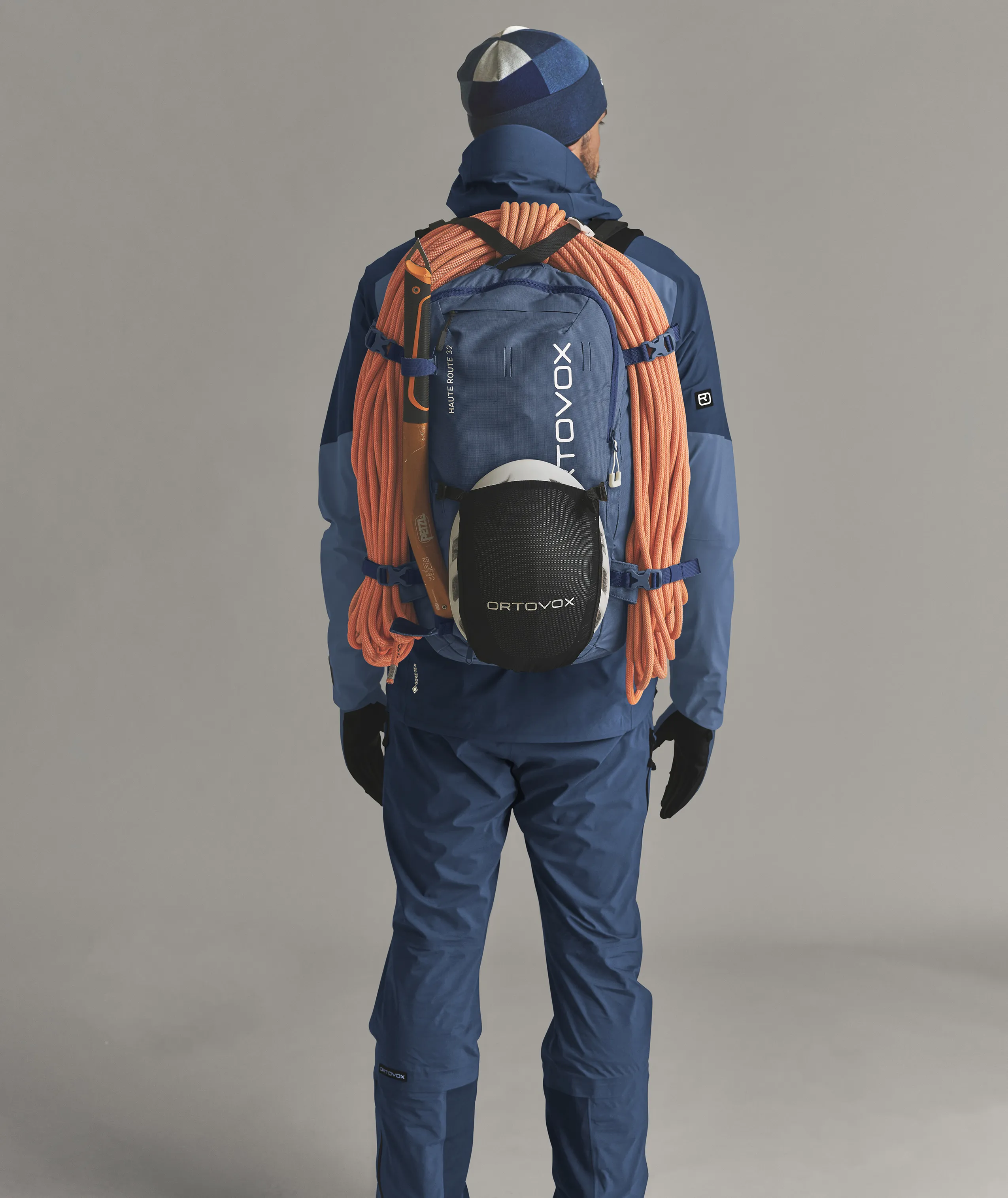 backpack, climbing gear, rope, jacket, pants