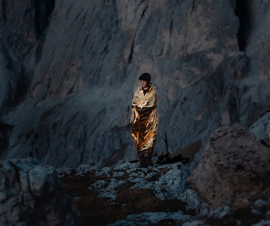 emergency blanket, golden blanket, outerwear, rocky terrain, mountain landscape