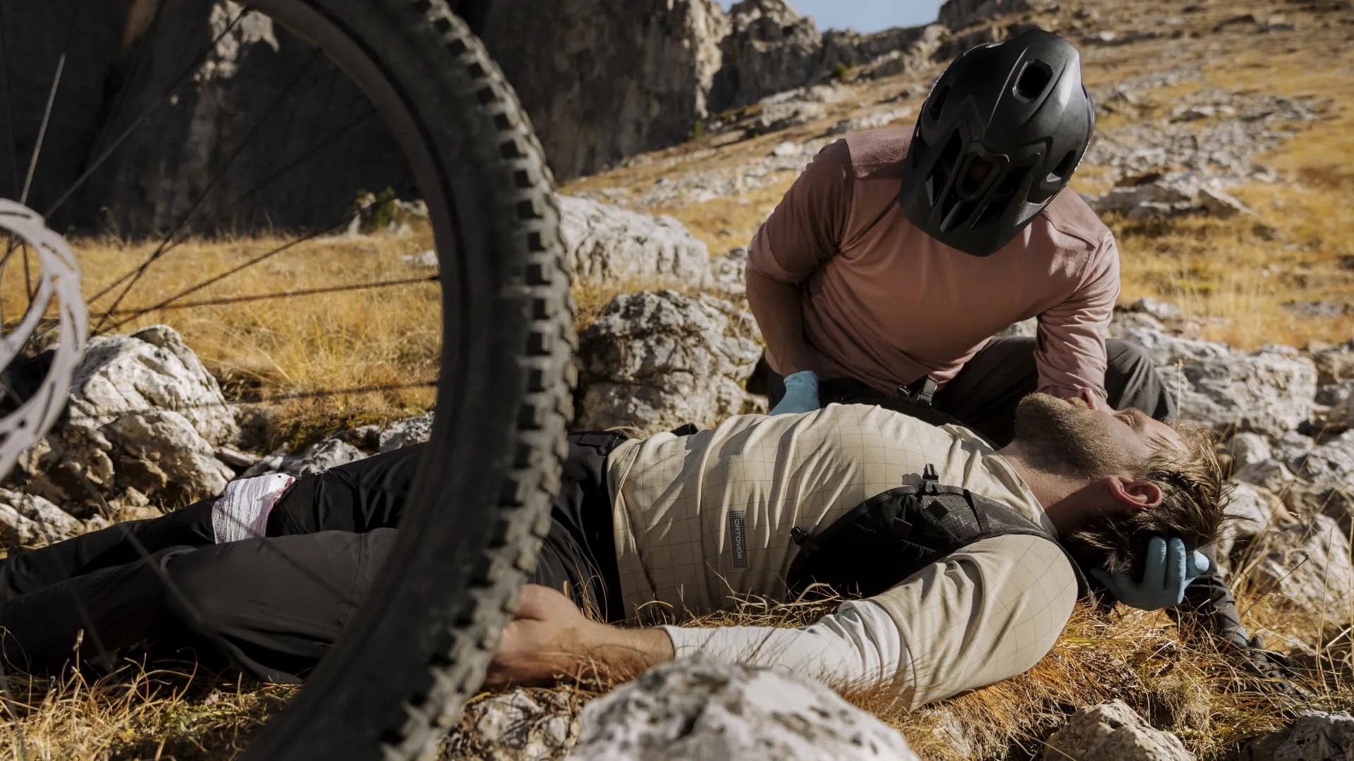mountain biking, bicycle accident, first aid, helmet, outdoor terrain, mountain bike, biker, helmet, outdoor, rescue