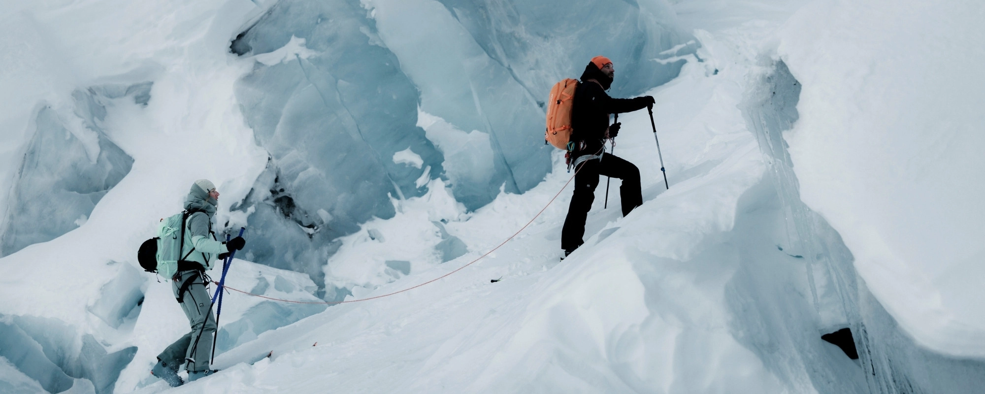 ORTOVOX_Header_HardshellSoftshell_Desktop ice climbing, mountaineering, climbing gear, orange backpack, snow